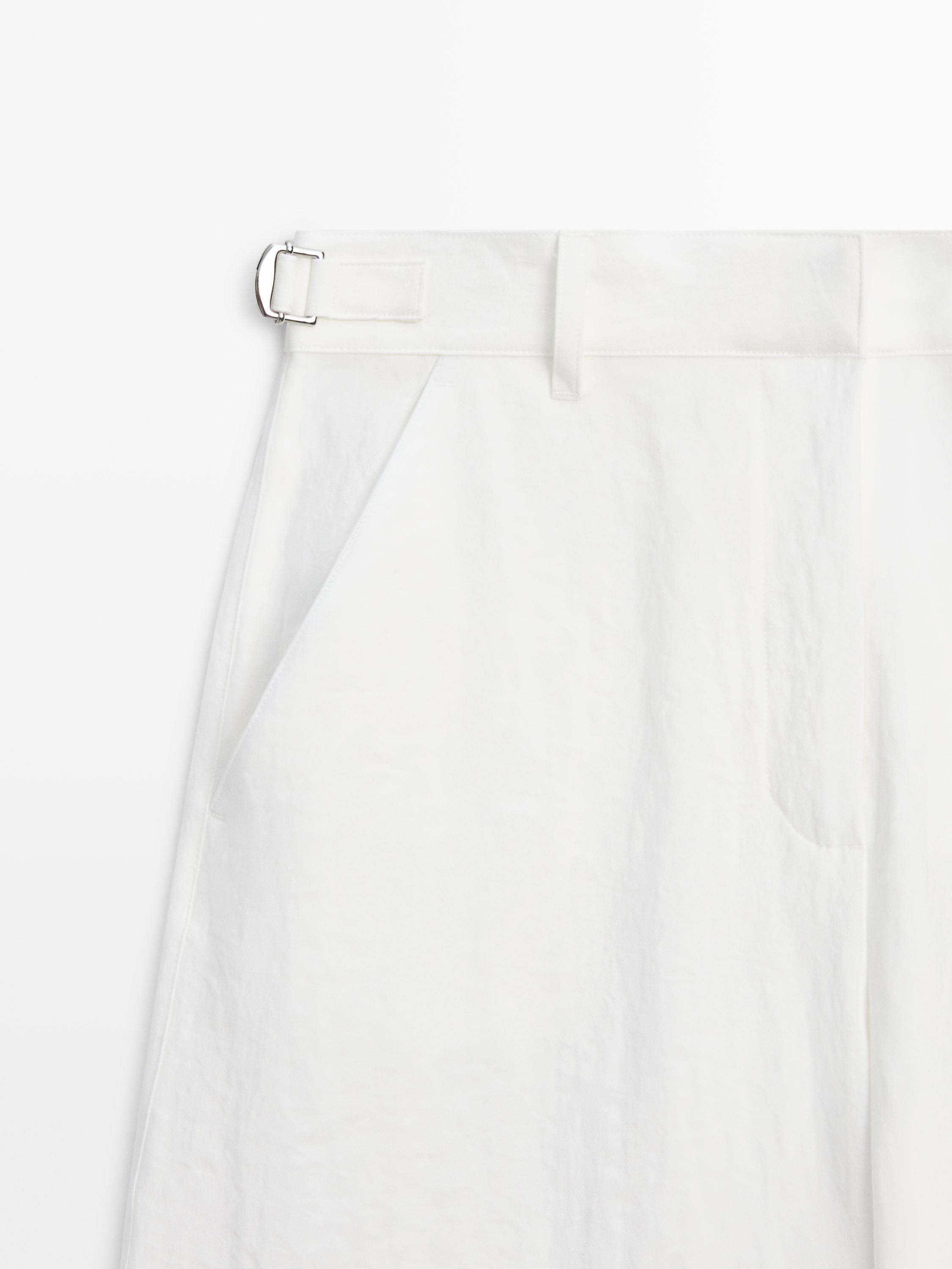 Flowing trousers with buckles